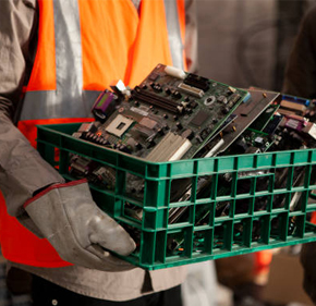 Technician sorting electronic waste